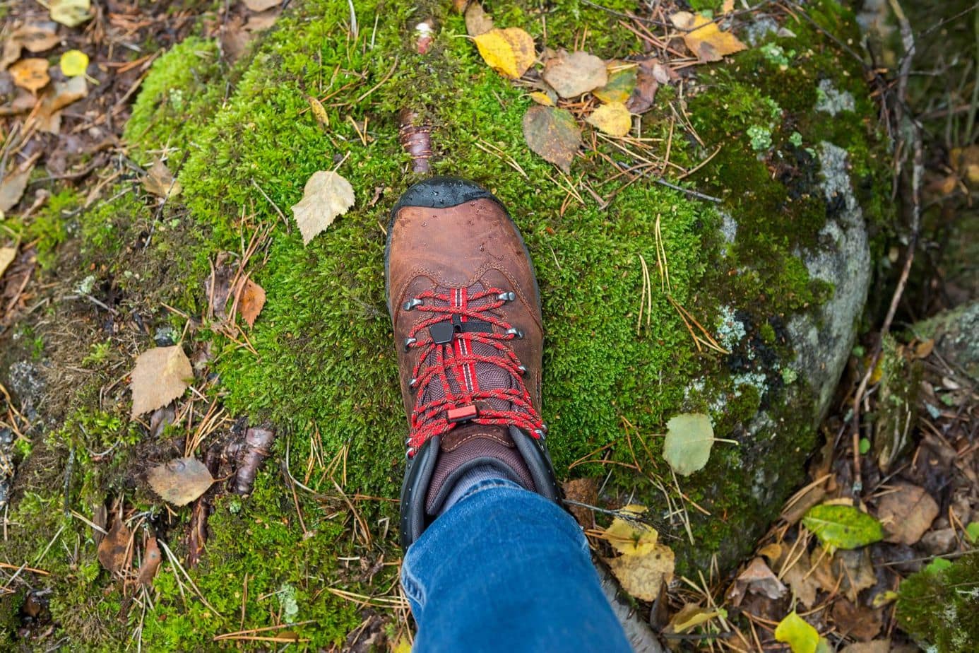 Woman’s foot in trekking boots